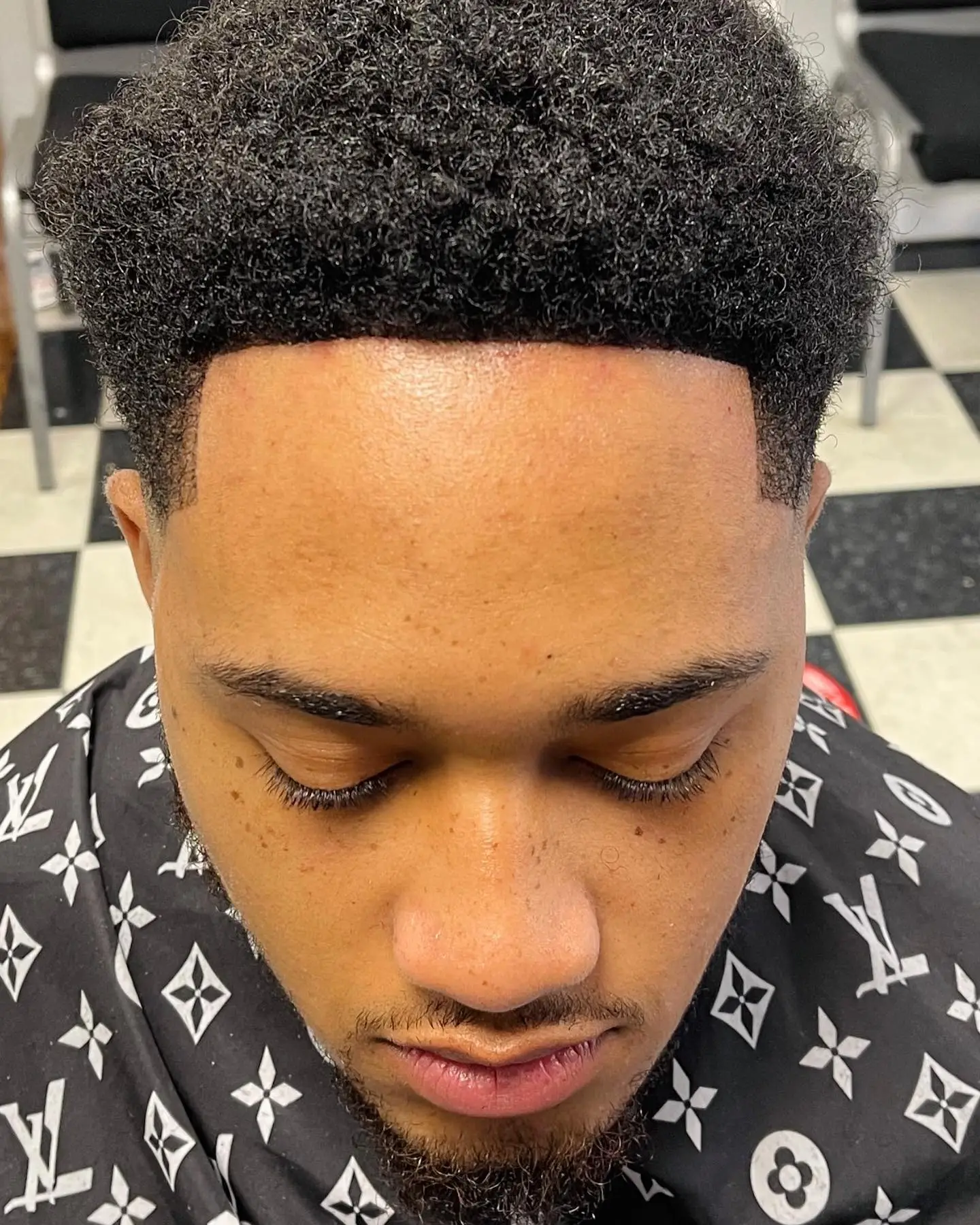 Sponge curls with a fade, cut by Maxx in Beacon