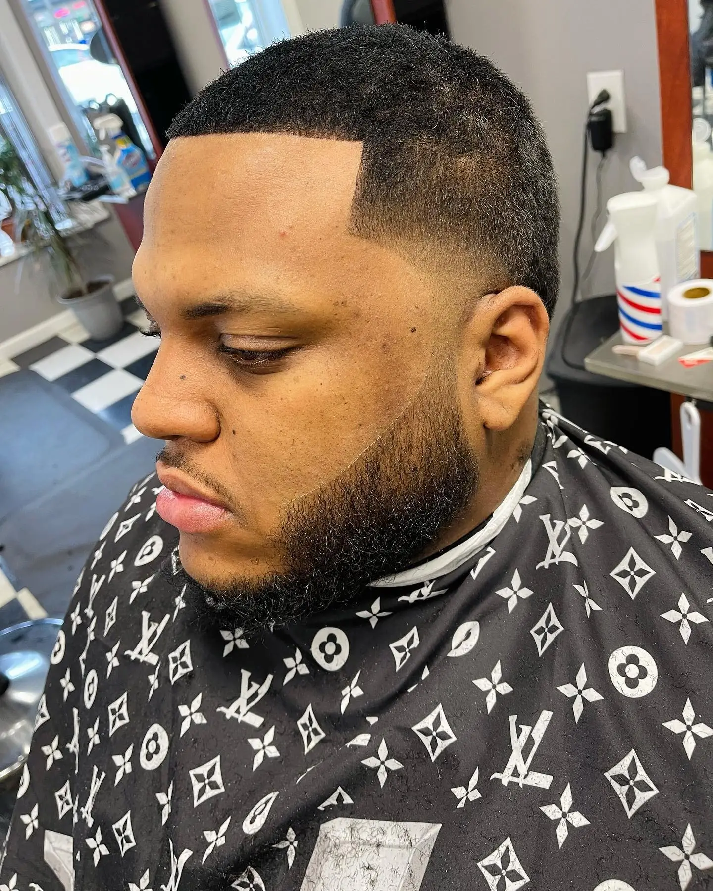 Full beard trim with a sharp line-up and fade
