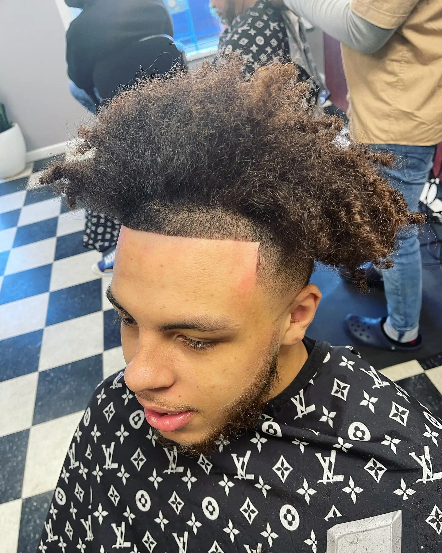 Curly top with a burst taper at Beacon Fade & Shave